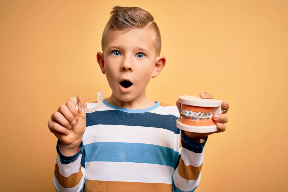 Child with braces who needs guidance from their parent