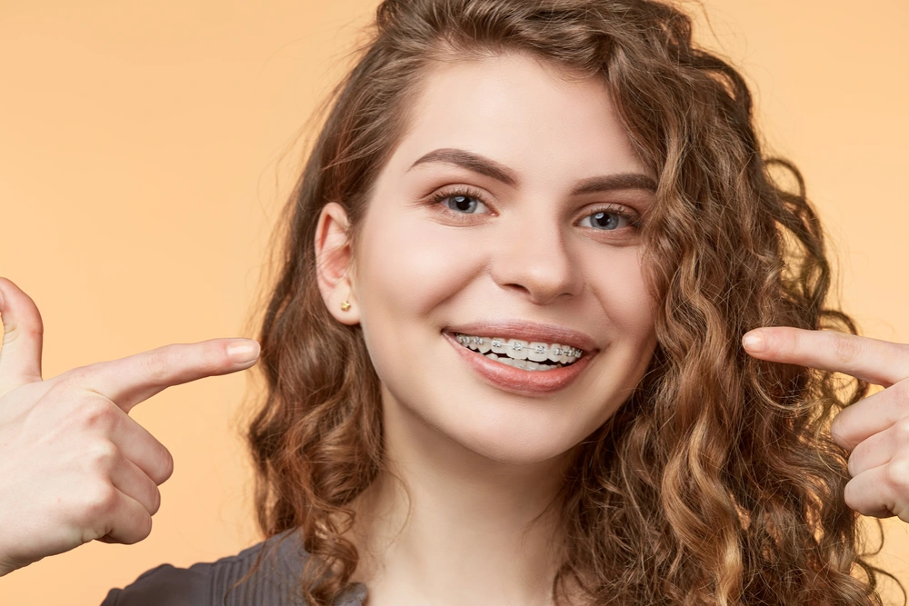 young woman with ceramic braces