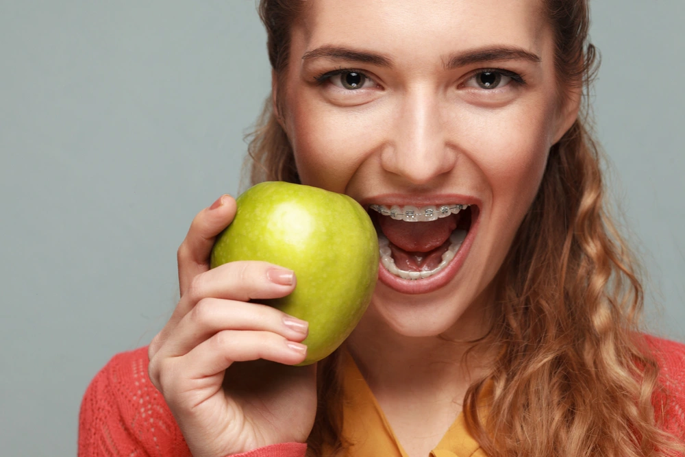 A girl deciding between braces or invisalign