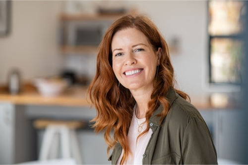 Mature woman smiling following orthodontic treatment for crooked teeth at MP Orthodontics in Cheltenham Victoria